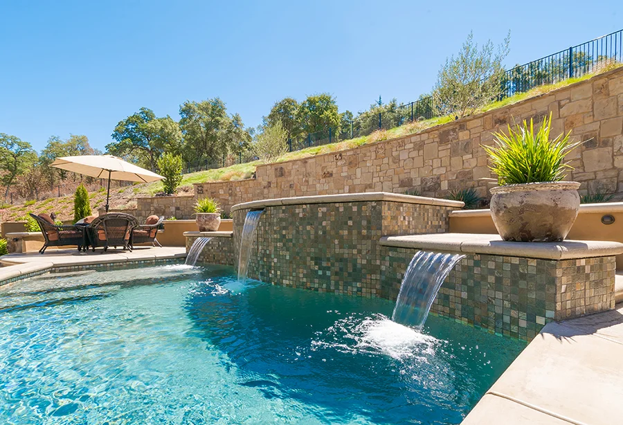 Outdoor pool with waterfall