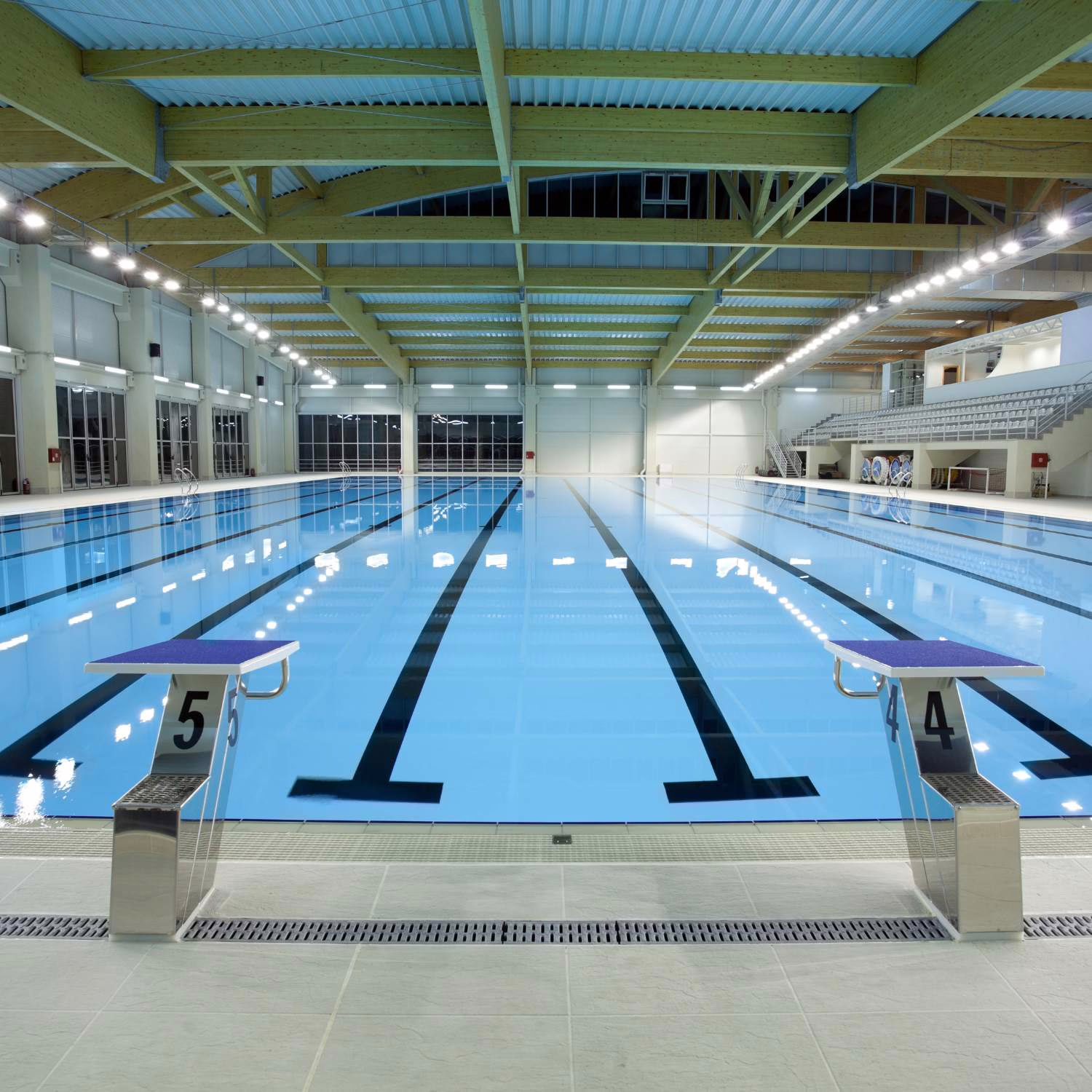 Indoor pool with blue tiles and clear water